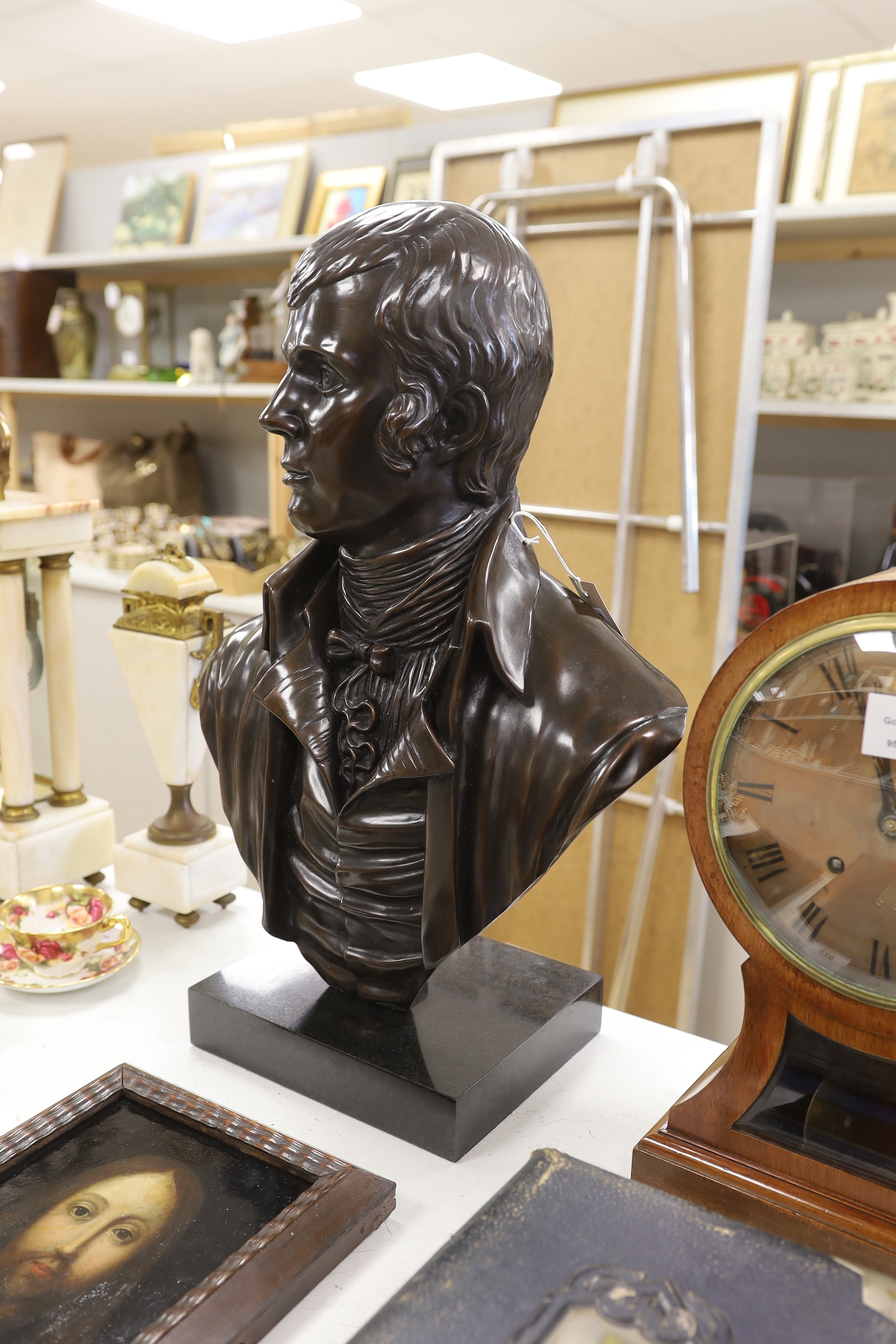 A bronze bust of Robert Burns, signed Cornell, 61cm